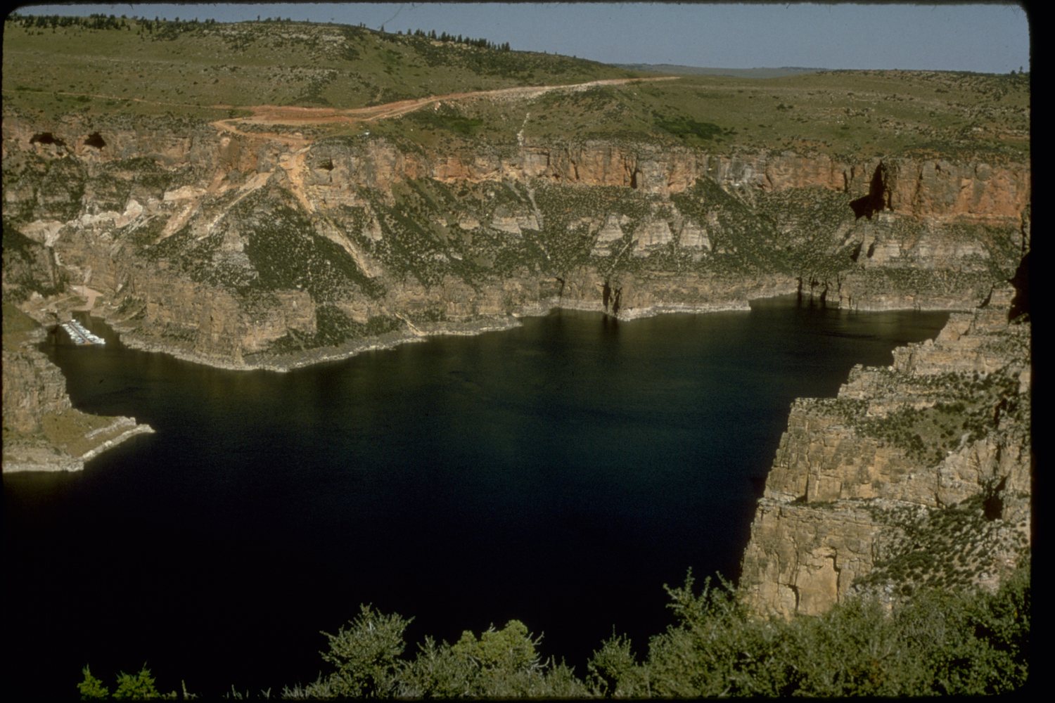 The sheer walls of Bighorn Canyon dropping to the river far below.